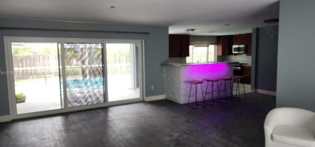 living room featuring baseboards