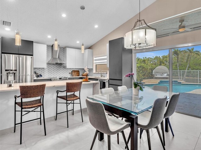 dining space featuring lofted ceiling, a notable chandelier, visible vents, and recessed lighting