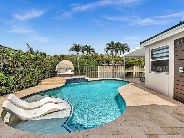 view of swimming pool featuring a fenced in pool, a patio area, and a fenced backyard