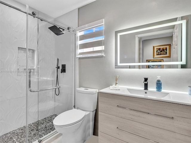 full bathroom with a shower stall, toilet, and vanity