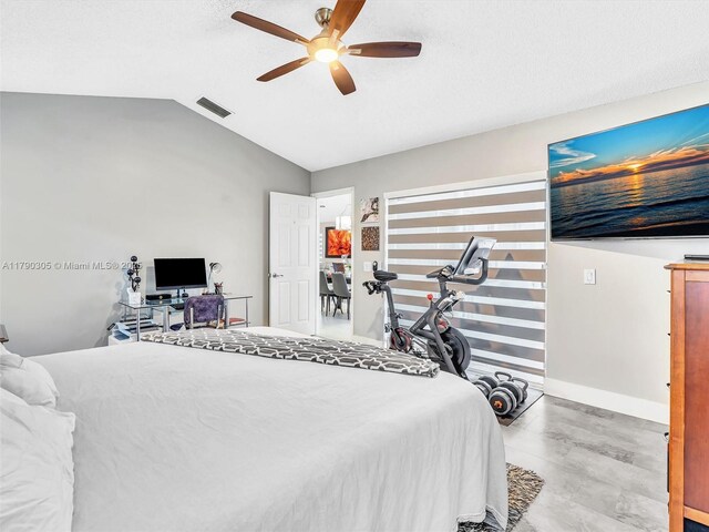 bedroom featuring ceiling fan, vaulted ceiling, visible vents, and baseboards