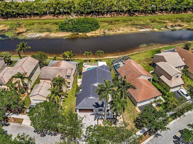 aerial view with a residential view and a water view