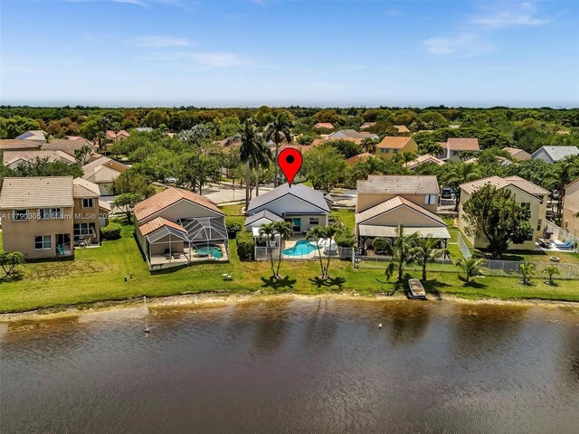 bird's eye view featuring a water view and a residential view
