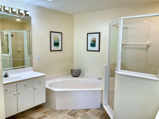 full bath with a shower stall, stone finish floor, a bath, and vanity