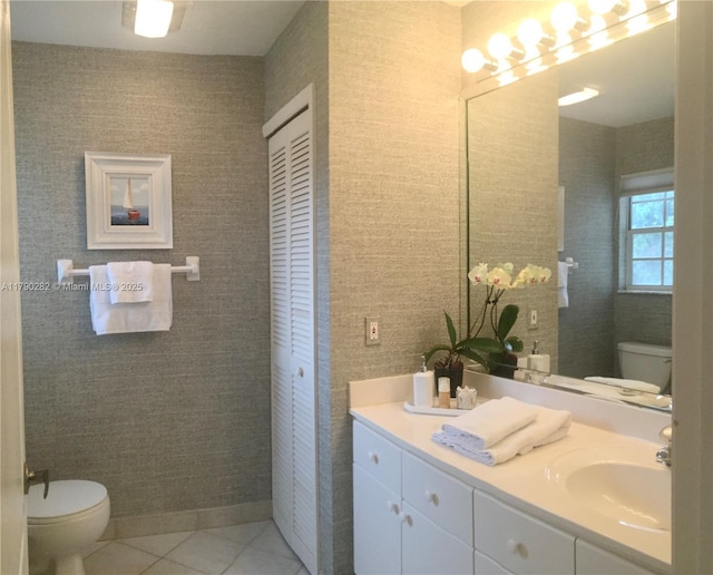bathroom featuring tile patterned floors, toilet, and vanity