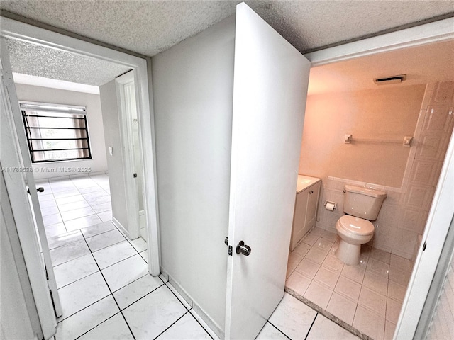 5900 SW 127th Ave Unit 3410, Miami, FL 33183 - bathroom with toilet, tile patterned floors, vanity, and a textured ceiling