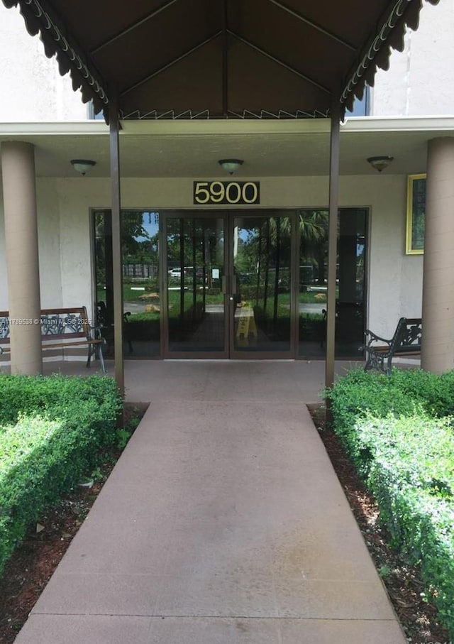 5900 SW 127th Ave Unit 3410, Miami, FL 33183 - view of exterior entry with french doors and stucco siding
