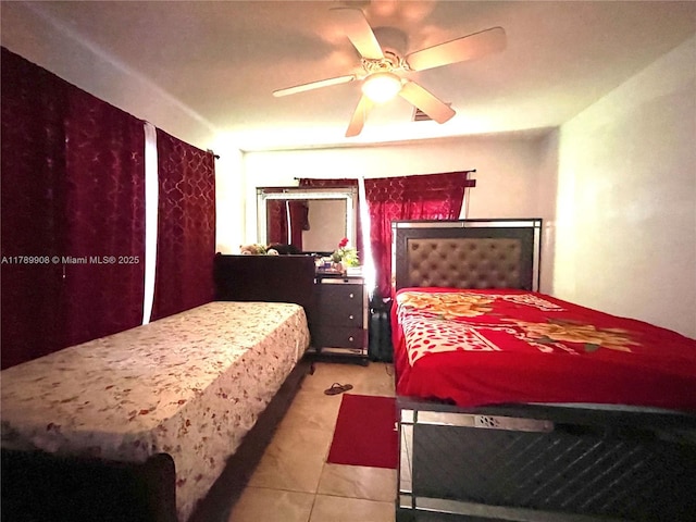 tiled bedroom with ceiling fan