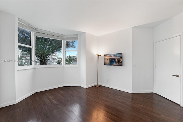 300 S Pointe Dr Unit 405, Miami Beach, FL 33139 - empty room featuring hardwood / wood-style floors, plenty of natural light, and baseboards