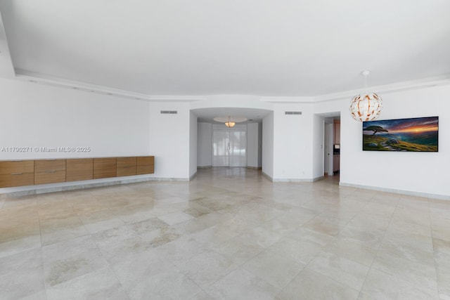 300 S Pointe Dr Unit 405, Miami Beach, FL 33139 - unfurnished living room featuring an inviting chandelier, visible vents, and baseboards
