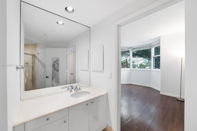 300 S Pointe Dr Unit 405, Miami Beach, FL 33139 - full bathroom with baseboards, recessed lighting, a shower stall, hardwood / wood-style flooring, and vanity