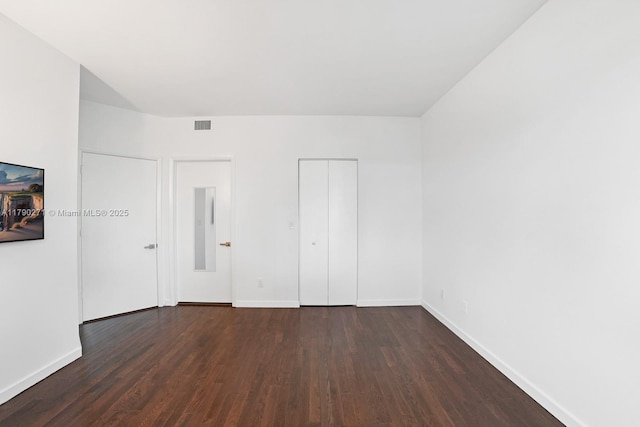 300 S Pointe Dr Unit 405, Miami Beach, FL 33139 - unfurnished bedroom with baseboards, wood finished floors, and a closet