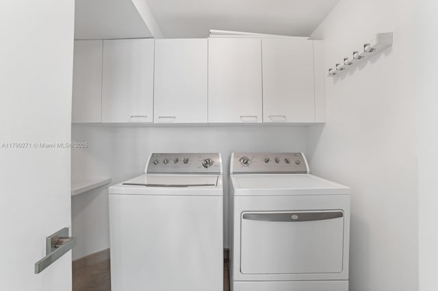 300 S Pointe Dr Unit 405, Miami Beach, FL 33139 - laundry area with cabinet space and washing machine and clothes dryer