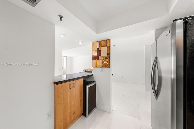 1775 Washington Ave Unit 11C, Miami Beach, FL 33139 - washroom with beverage cooler, light tile patterned flooring, and a dry bar