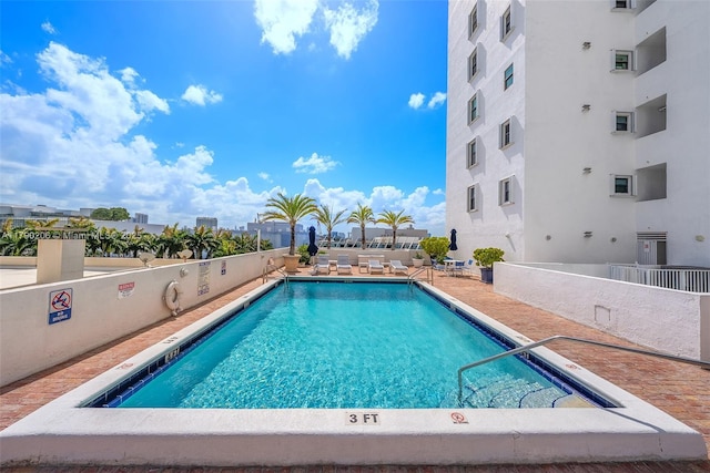 1775 Washington Ave Unit 11C, Miami Beach, FL 33139 - community pool with a patio area