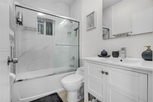 full bathroom featuring vanity, toilet, and enclosed tub / shower combo