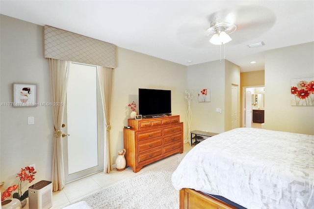 bedroom with ceiling fan and light tile patterned floors