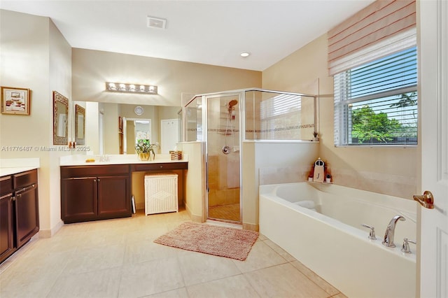 full bathroom with a stall shower, visible vents, tile patterned flooring, a garden tub, and vanity