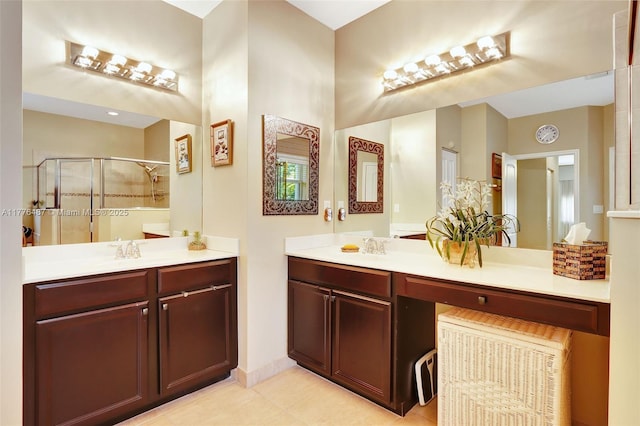 full bath with tile patterned floors, vanity, and a shower stall