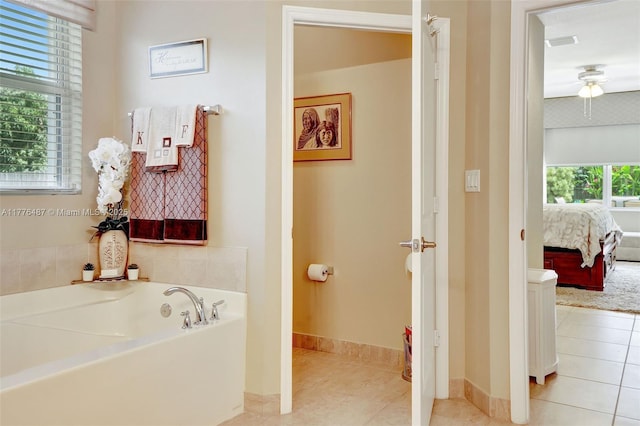 20951 SW 134th Ave, Miami, FL 33177 - ensuite bathroom with a garden tub, tile patterned floors, and baseboards