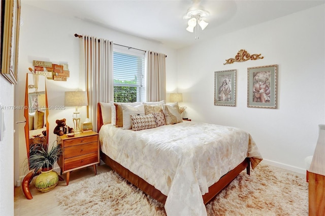 bedroom with baseboards and ceiling fan