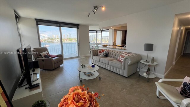 16570 NE 26th Ave Unit 4A, North Miami Beach, FL 33160 - living area featuring baseboards