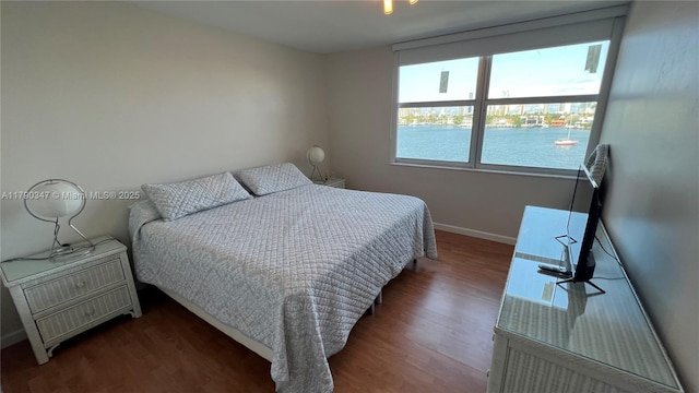 16570 NE 26th Ave Unit 4A, North Miami Beach, FL 33160 - bedroom with wood finished floors, baseboards, and a water view