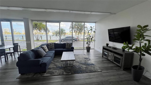 16570 NE 26th Ave Unit 4A, North Miami Beach, FL 33160 - living room featuring healthy amount of natural light and baseboards