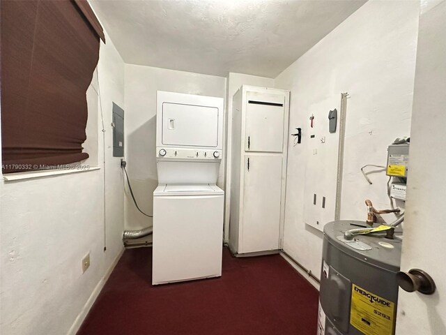 laundry area featuring stacked washer / dryer, electric panel, baseboards, electric water heater, and laundry area