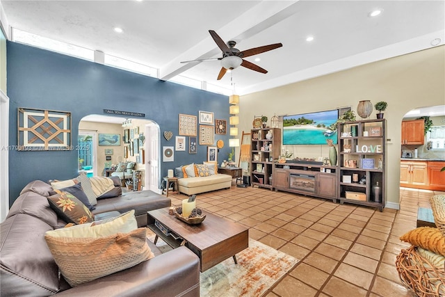 living area with recessed lighting, arched walkways, a ceiling fan, and light tile patterned floors