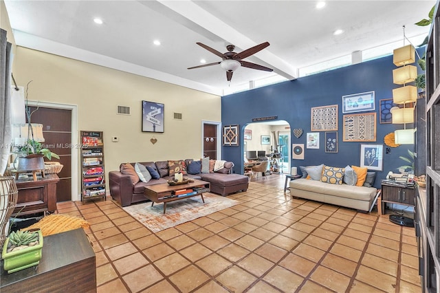living area with visible vents, arched walkways, a ceiling fan, and recessed lighting
