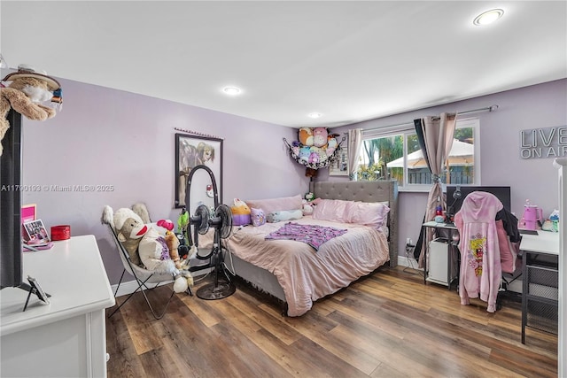bedroom featuring recessed lighting, baseboards, and wood finished floors