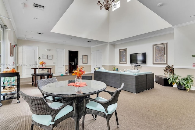 dining room with recessed lighting, carpet, visible vents, and ornamental molding