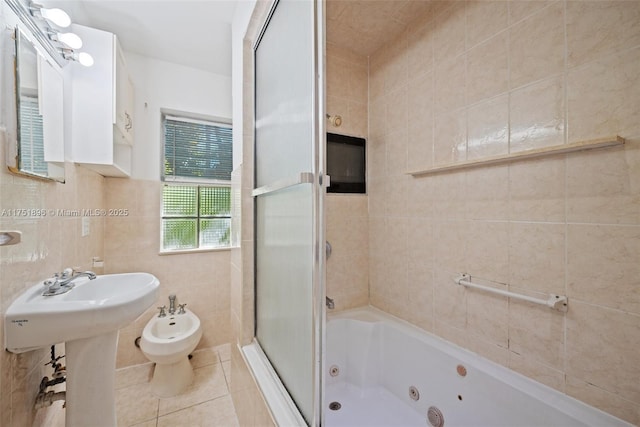 10635 NE 11th Ct, Miami Shores, FL 33138 - full bathroom with a tub with jets, a bidet, a shower with shower door, tile walls, and tile patterned flooring