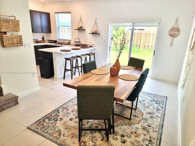 1867 SE 26th Ter, Homestead, FL 33035 - dining space featuring baseboards and light tile patterned floors