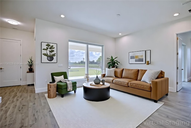 5224 Columbus Blvd, Sebring, FL 33872 - living room with light wood-type flooring, baseboards, and recessed lighting