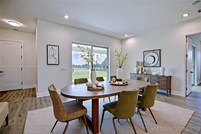 5224 Columbus Blvd, Sebring, FL 33872 - dining area with light wood-style flooring, baseboards, and recessed lighting