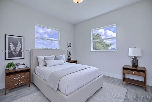 5224 Columbus Blvd, Sebring, FL 33872 - bedroom featuring light wood-type flooring and baseboards