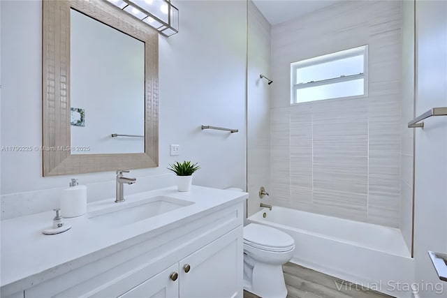 5224 Columbus Blvd, Sebring, FL 33872 - bathroom with vanity, toilet, bathing tub / shower combination, and wood finished floors