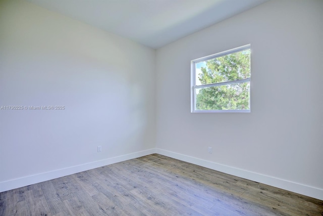 5224 Columbus Blvd, Sebring, FL 33872 - empty room with wood finished floors and baseboards