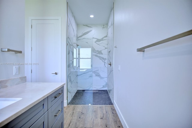 5224 Columbus Blvd, Sebring, FL 33872 - bathroom with recessed lighting, wood finished floors, vanity, a marble finish shower, and baseboards