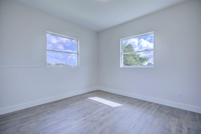 5224 Columbus Blvd, Sebring, FL 33872 - unfurnished room with baseboards and wood finished floors