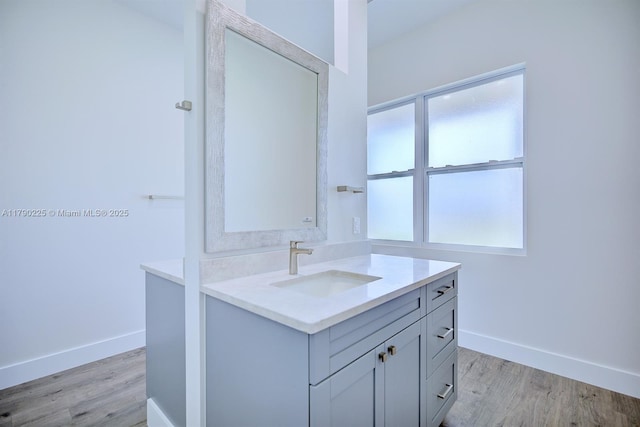 5224 Columbus Blvd, Sebring, FL 33872 - bathroom with vanity, wood finished floors, and baseboards
