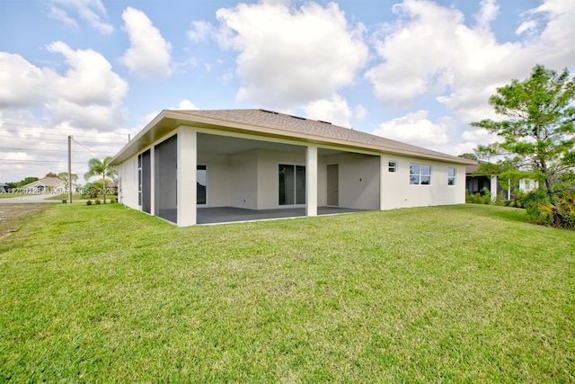 5224 Columbus Blvd, Sebring, FL 33872 - rear view of property featuring stucco siding, a patio area, and a yard