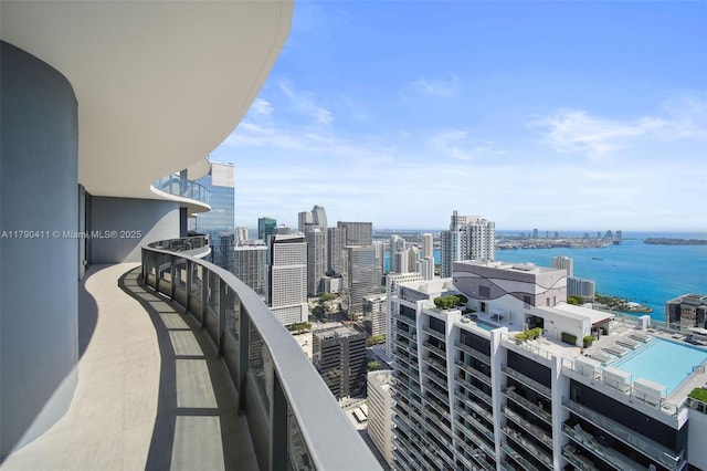 balcony with a city view and a water view