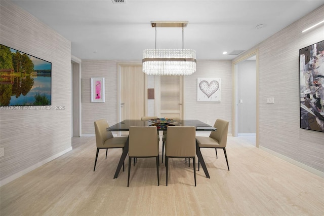 1000 Brickell Plz Unit Ph5603, Miami, FL 33131 - dining room featuring light wood-style flooring, a chandelier, and baseboards