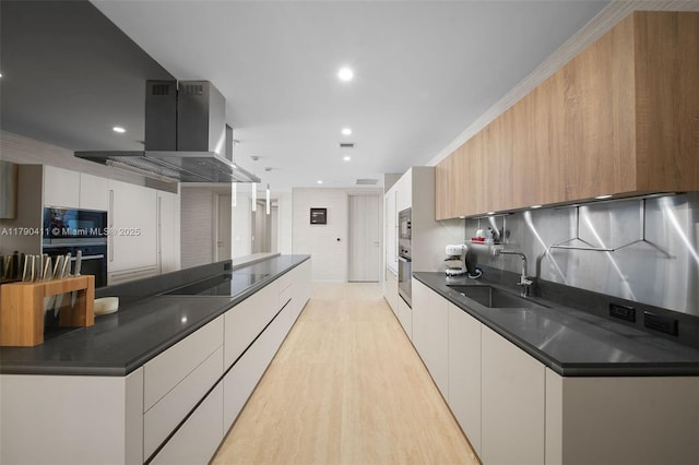 1000 Brickell Plz Unit Ph5603, Miami, FL 33131 - kitchen with a sink, black appliances, dark countertops, modern cabinets, and recessed lighting