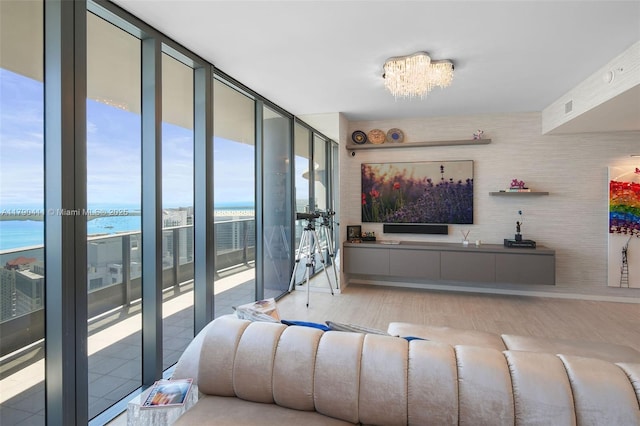 1000 Brickell Plz Unit Ph5603, Miami, FL 33131 - living area with wood finished floors, floor to ceiling windows, and a chandelier