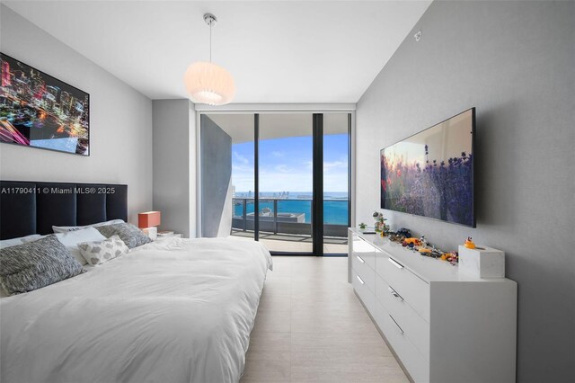 1000 Brickell Plz Unit Ph5603, Miami, FL 33131 - bedroom featuring a wall of windows and access to exterior