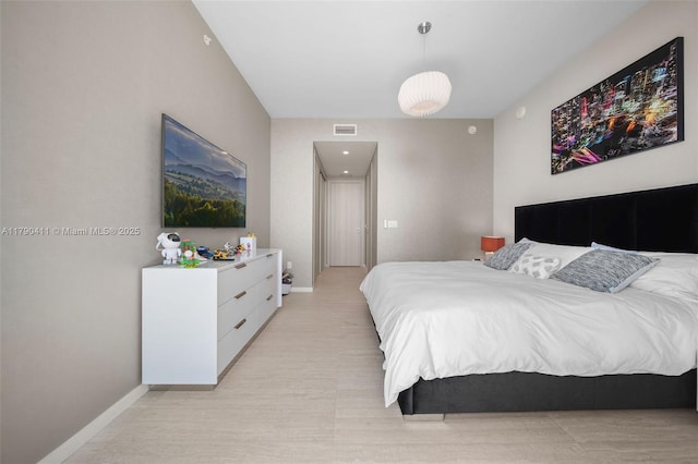 1000 Brickell Plz Unit Ph5603, Miami, FL 33131 - bedroom featuring baseboards and light wood-style flooring